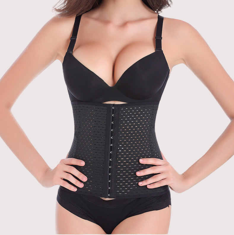 Black waist trainer worn by a model on a white background